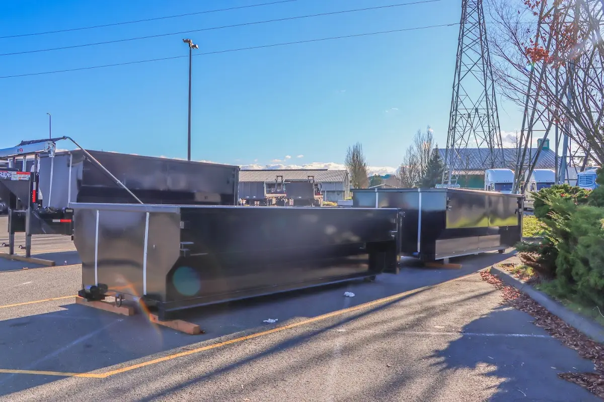 Roll-off dumpster ready for waste disposal at job site for 2 Yard Dumpster Rental in Girard